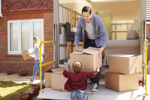 Removal truck loading boxes and furniture for a Putney home move