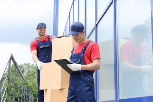 Local Putney removals team unloading boxes and furniture at a new property