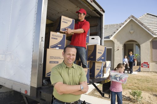 Local movers handling furniture and boxes for a Putney home move