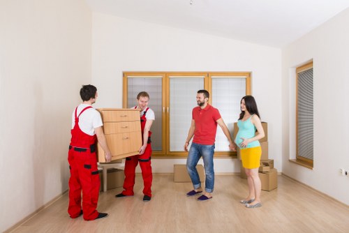 Packed moving boxes and furniture ready for house removals in Putney