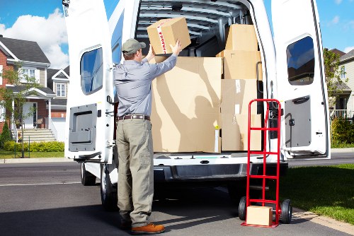 Local removalists unloading boxes at a Putney home with limited access
